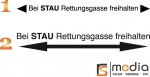 Bei Stau Rettungsgasse freihalten - Schriftband mit Pfeilen